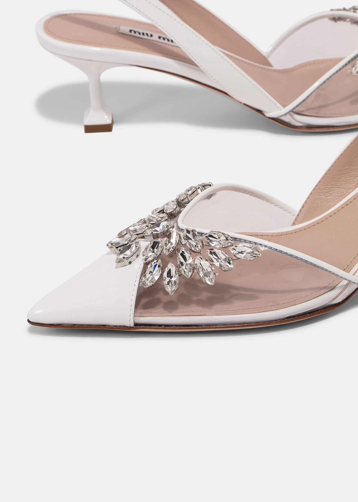 

Patent slingback pumps, White