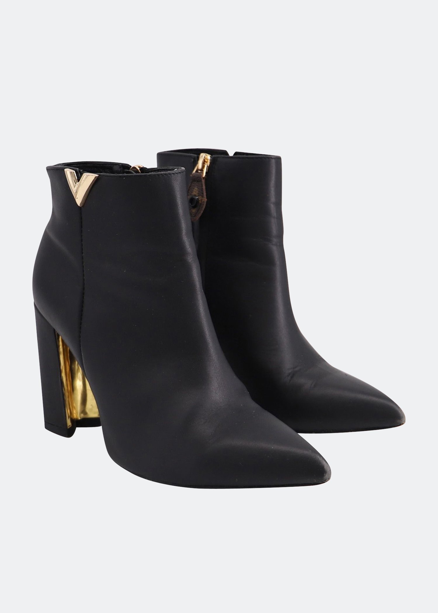 

Gold accent ankle boots in black leather